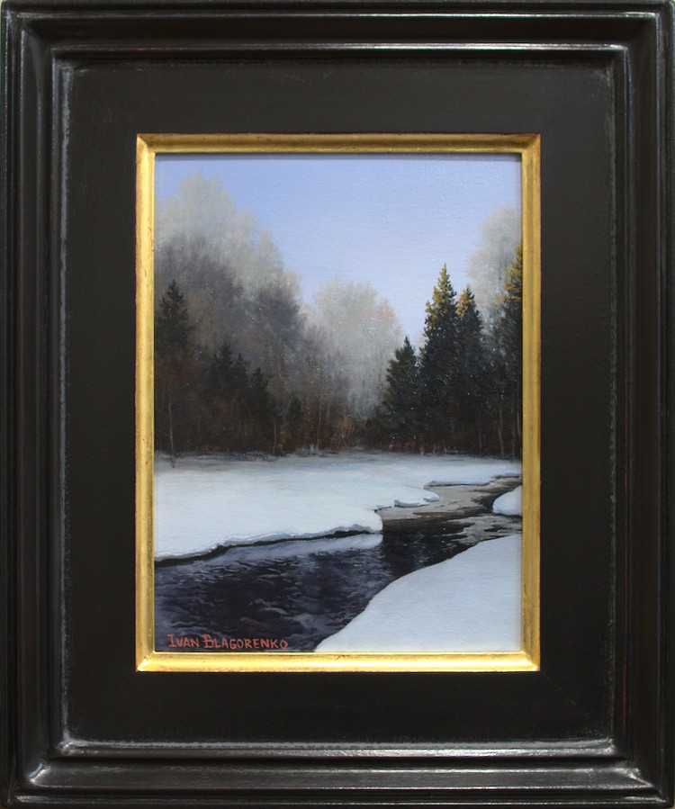 Winter landscape with stream running through