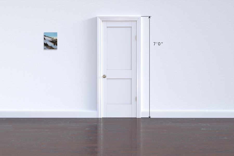 Early morning in the winter showing first ski tracks on the mountain slope