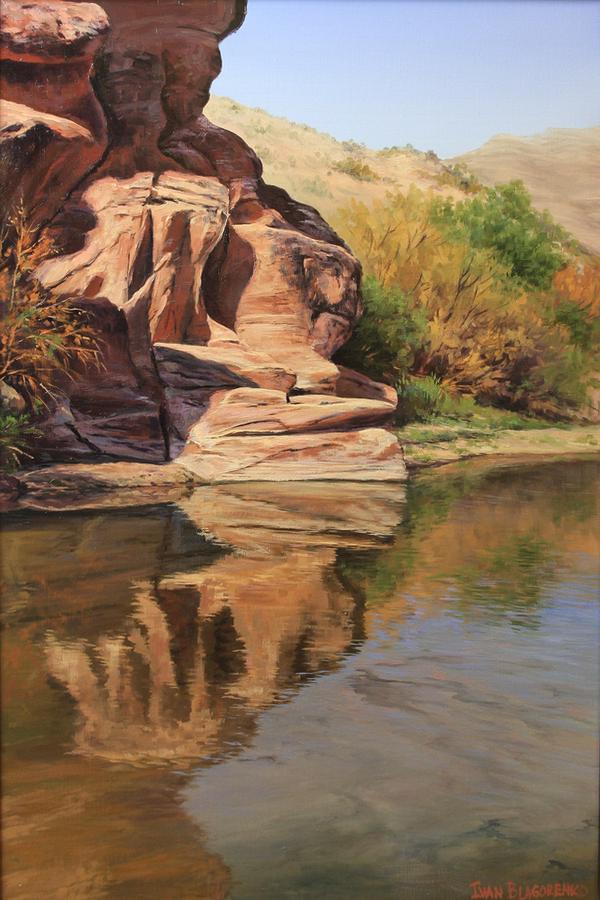 Southern Utah red rock formation reflecting in the water