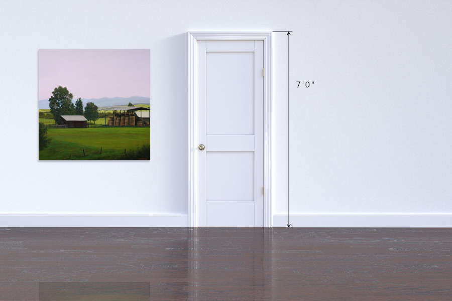 Calm summer evening with shed and hay stacks
