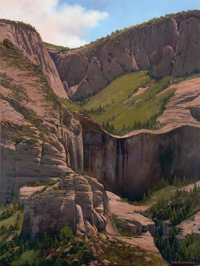 Red rock mountain vertical drop with sunshine